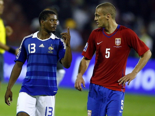 France's Evra speaks with Serbia's Vidic after their 2010 World Cup soccer qualifying match in Belgrade